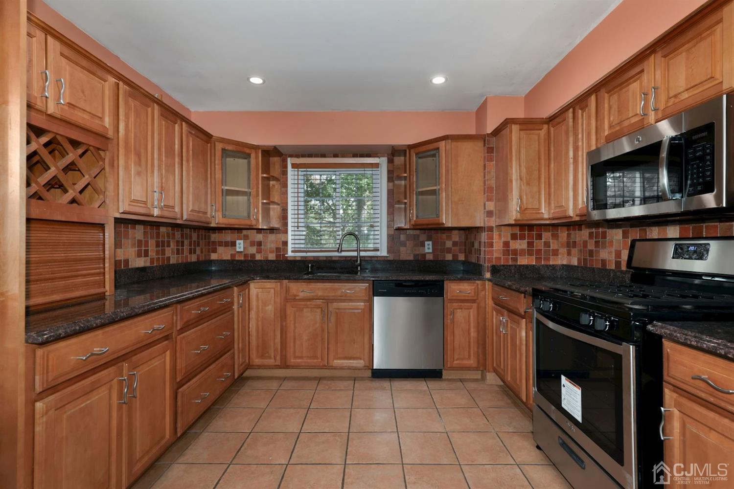 26 Donald Road East Brunswick, NJ 08816 - Photo 6 of 27 a kitchen with stainless steel appliances granite countertop a stove sink and cabinets