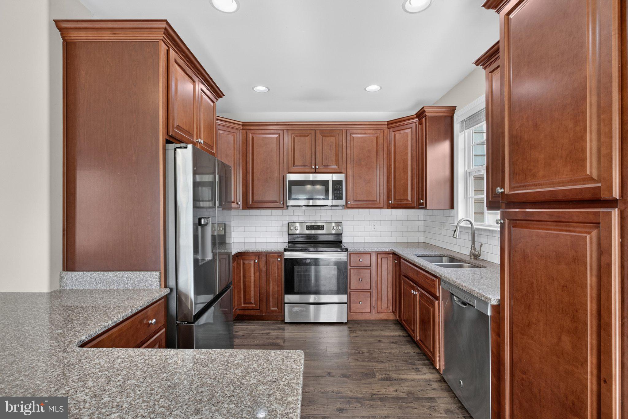 27 Sun Ridge Drive Felton, DE 19943 - Photo 19 of 61 Modern kitchen with rich wood cabinetry.