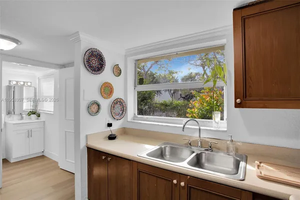 a kitchen with a sink and a window