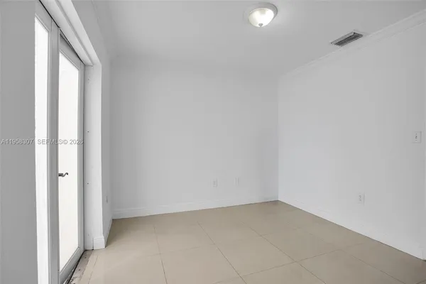 a view of an empty room and window