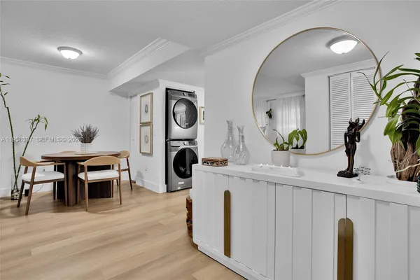 a living room with furniture a clock and a mirror