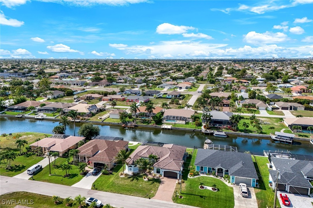 an aerial view of a house with a lake view