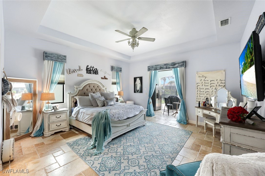 208 Southwest 15th Street Cape Coral, FL 33991 - Photo 15 of 50 a living room with furniture and a flat screen tv