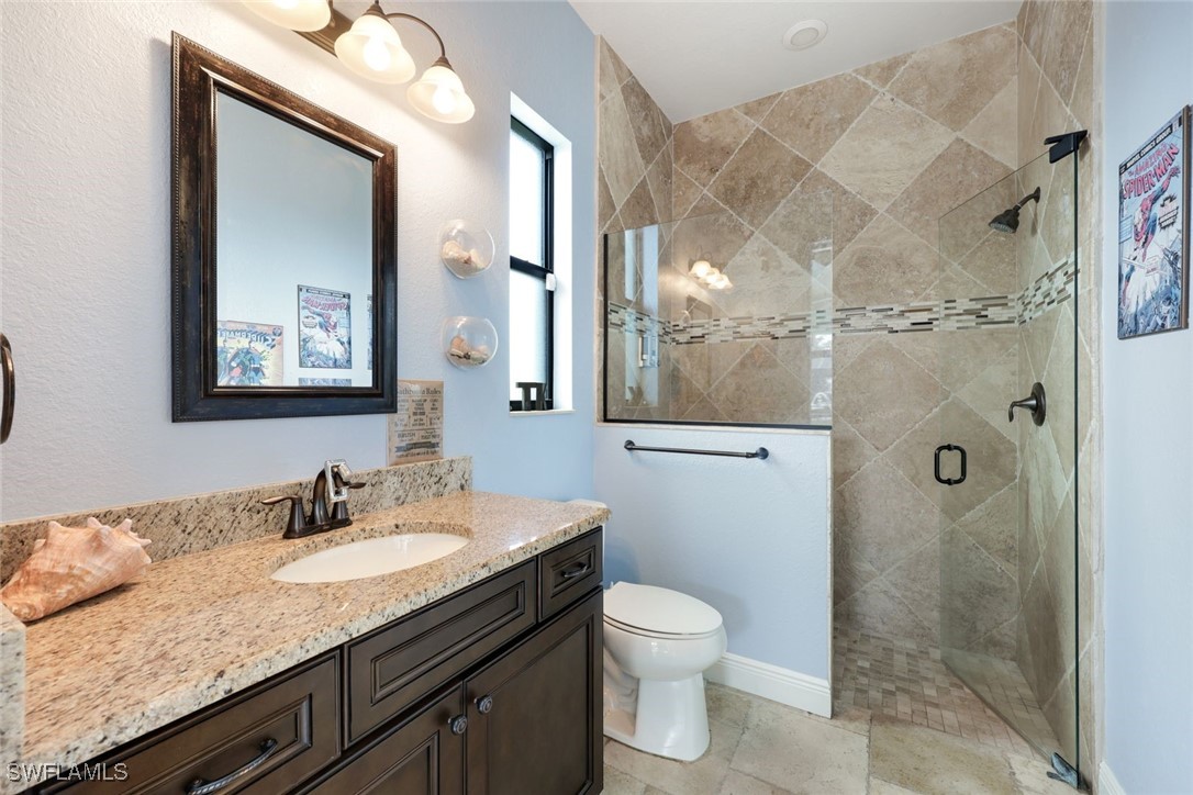 208 Southwest 15th Street Cape Coral, FL 33991 - Photo 20 of 50 a bathroom with a granite countertop sink toilet and shower