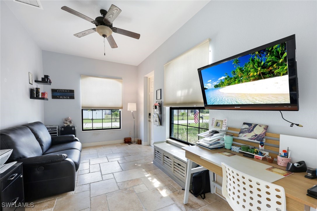 208 Southwest 15th Street Cape Coral, FL 33991 - Photo 23 of 50 a room with furniture and a flat screen tv