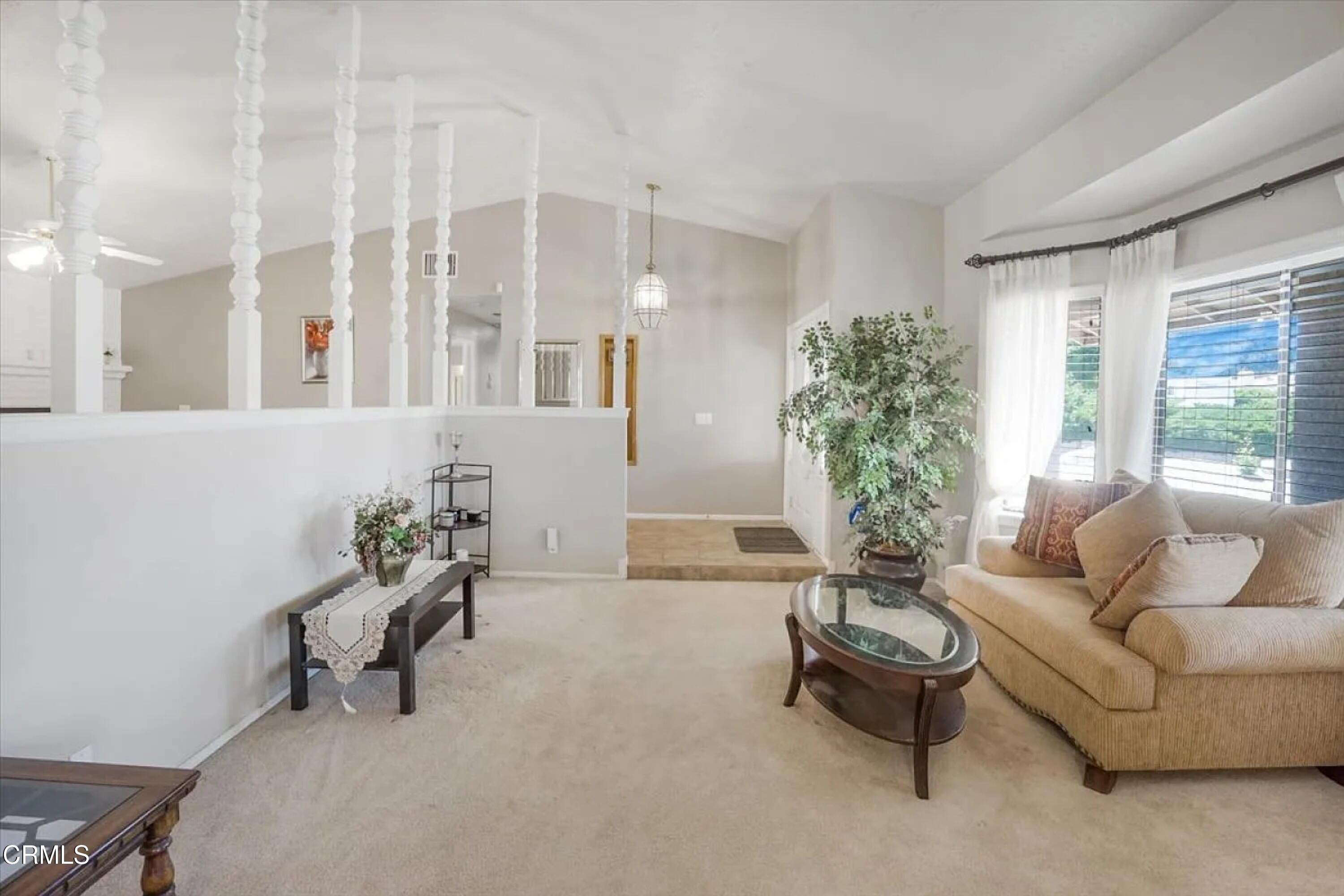 14027 Chogan Road Apple Valley, CA 92307 - Photo 3 of 33 a living room with furniture and a large window