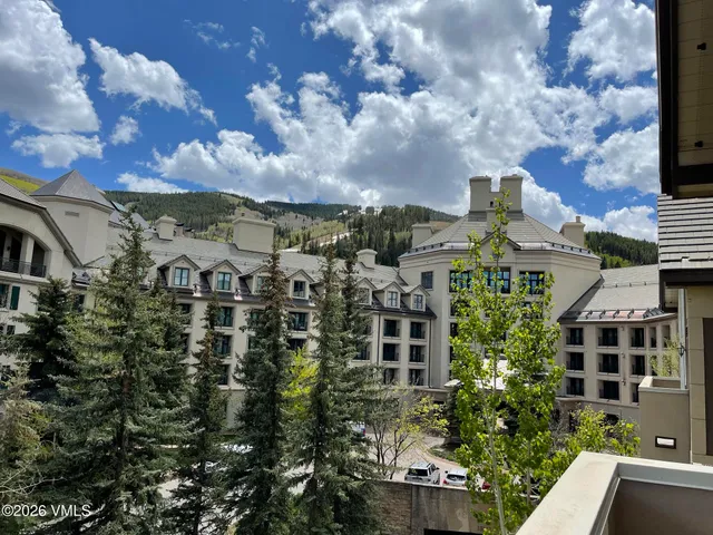 a view of building with lot of trees