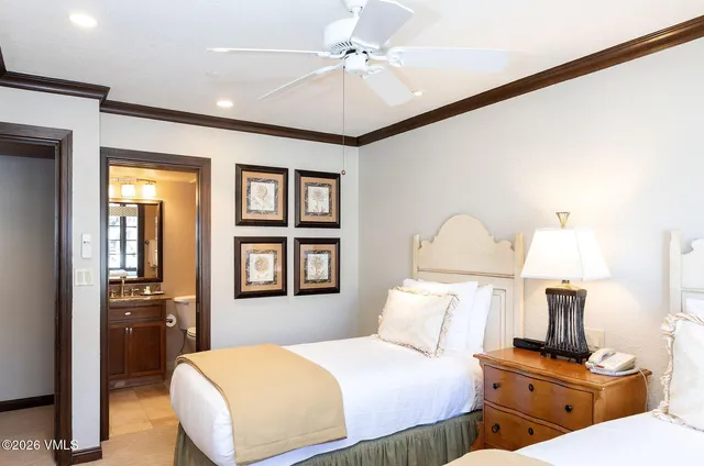 a bedroom with bed and a night stand