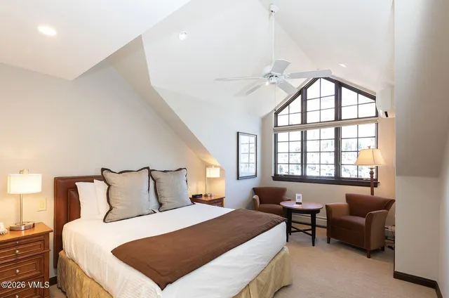 a bedroom with a bed and a couch