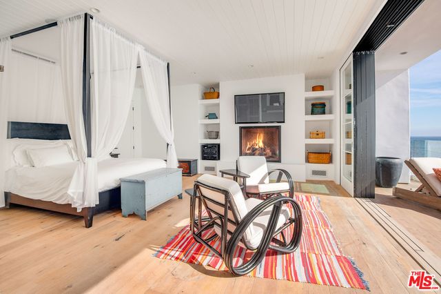 a living room with furniture a table and chair