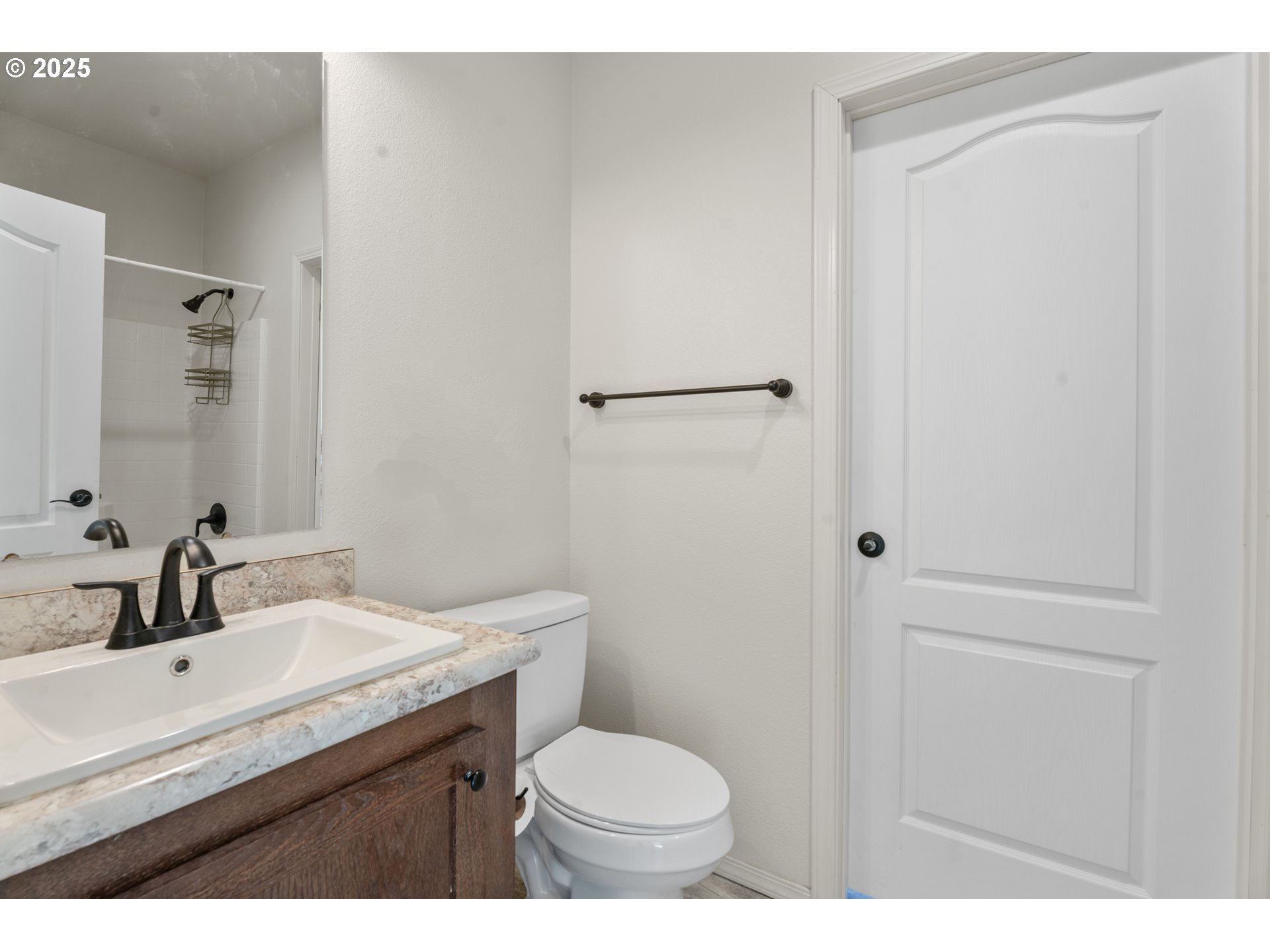9700 Southwest Tualatin Road, Unit 9 Tualatin, OR 97062 - Photo 15 of 18 a bathroom with a sink toilet and vanity