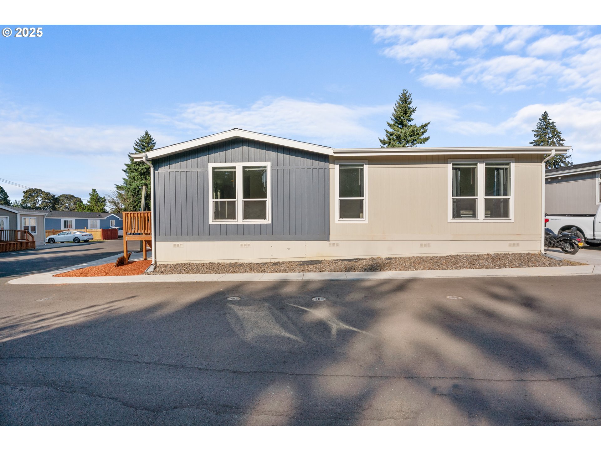 9700 Southwest Tualatin Road, Unit 9 Tualatin, OR 97062 - Photo 16 of 18 a front view of a house with a yard