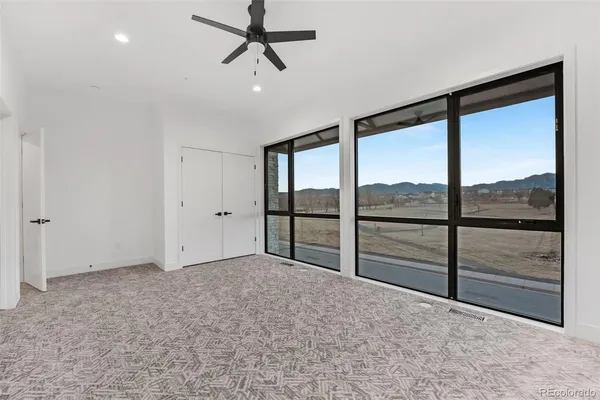 a view of room with air conditioner and windows