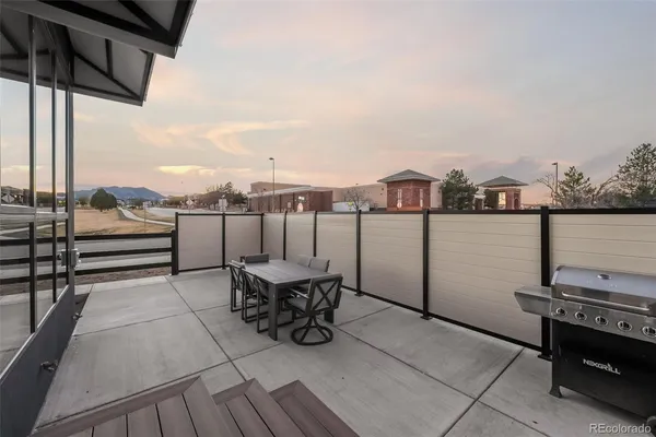 a view of roof deck with seating space
