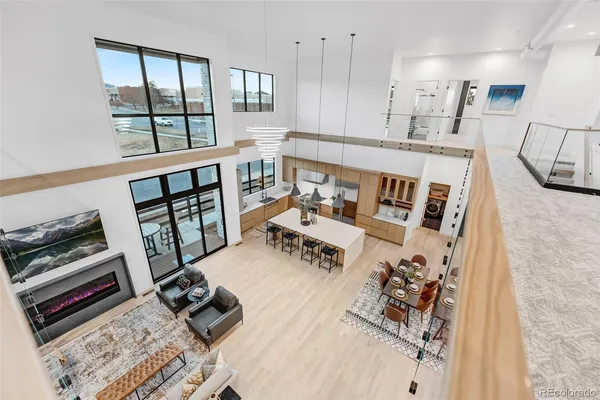 a living room with furniture and a floor to ceiling window