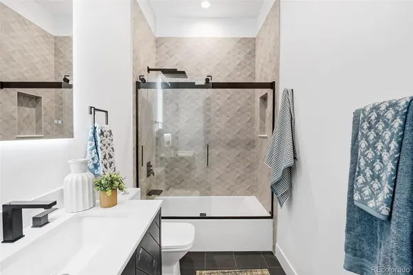 a view of bathroom with shower and wooden floor