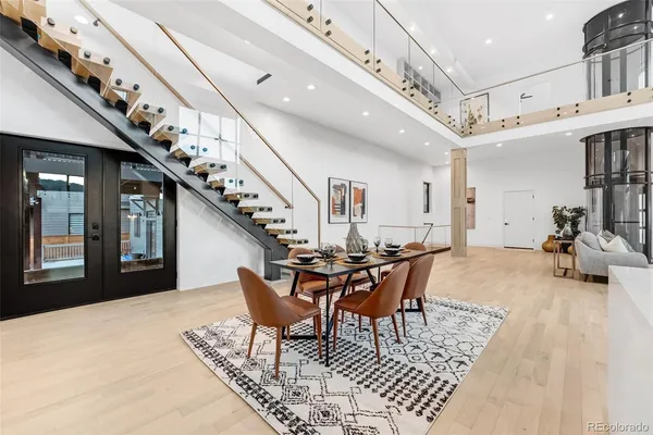 a dining room with furniture and entryway