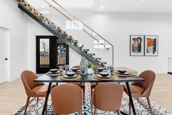 a view of a dining room with furniture window and wooden floor