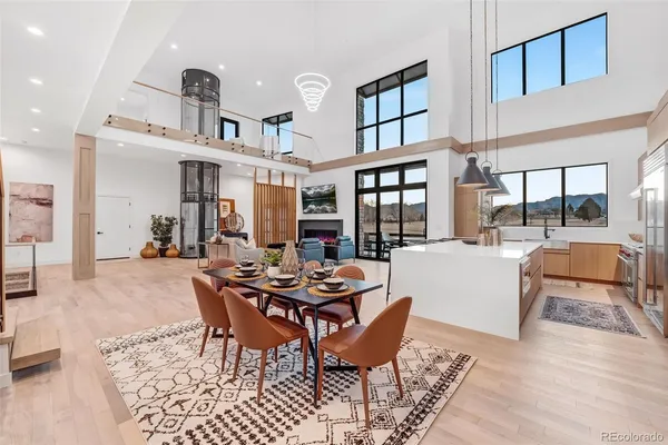 a dining room with furniture and wooden floor