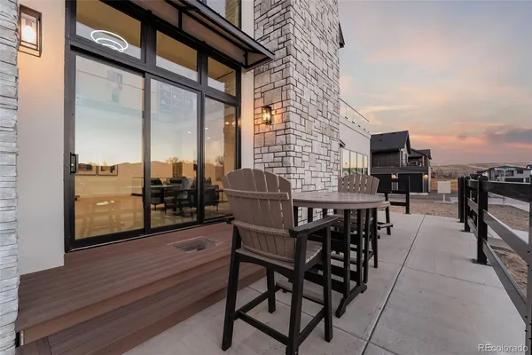 a patio with table and chairs