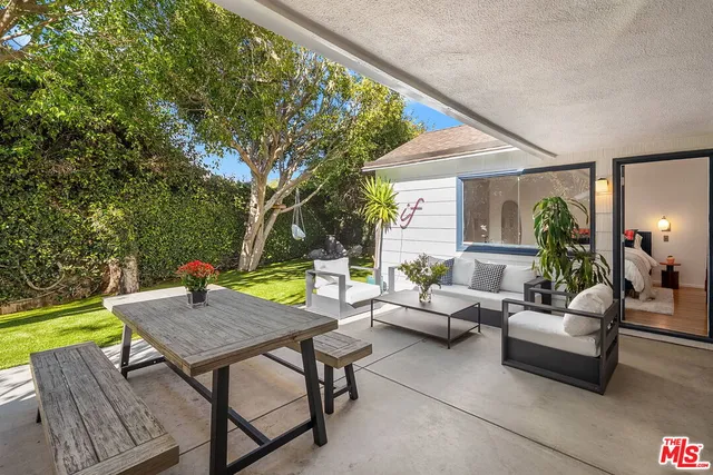 a outdoor living space with furniture and garden view