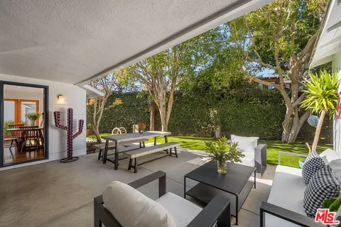 a outdoor living space with furniture and garden view