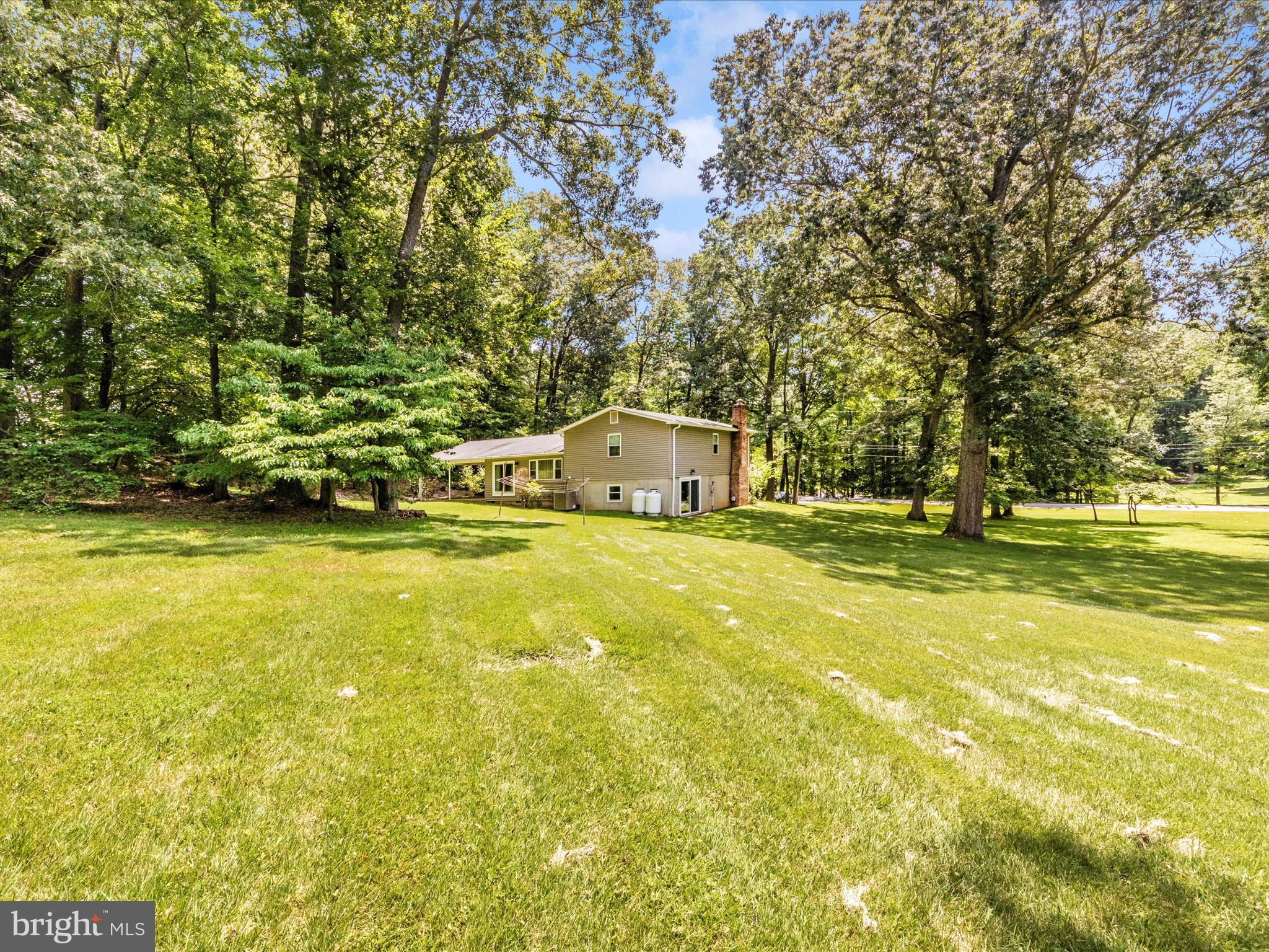 3180 Hunting Creek Road Huntingtown, MD 20639 - Photo 43 of 55 a front view of a house with a yard