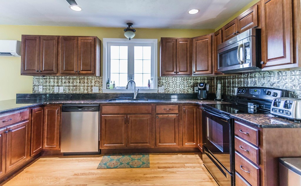 106 Pondview Road East Brookfield, MA 01515 - Photo 5 of 28 a kitchen with stainless steel appliances granite countertop a sink stove and cabinets