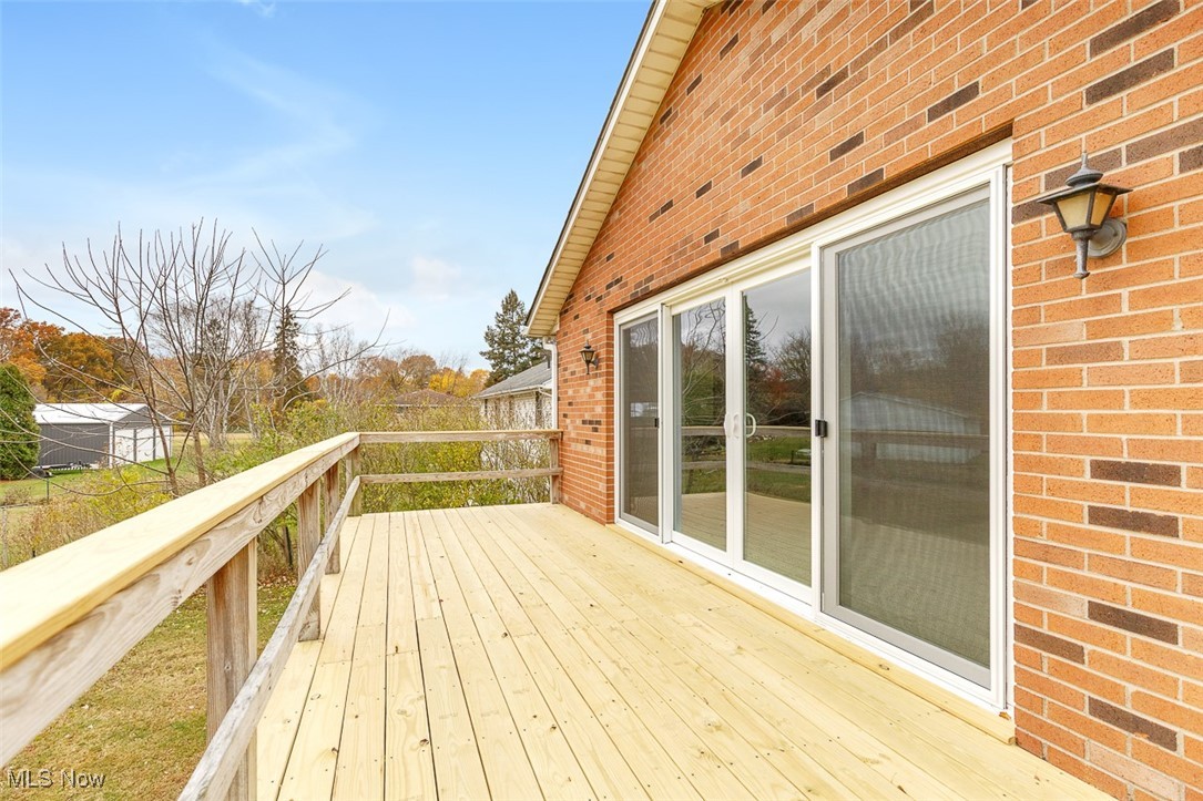 43800 Middle Ridge Road Lorain, OH 44053 - Photo 25 of 31 View of wooden wraparound deck and brand new sliding doors.