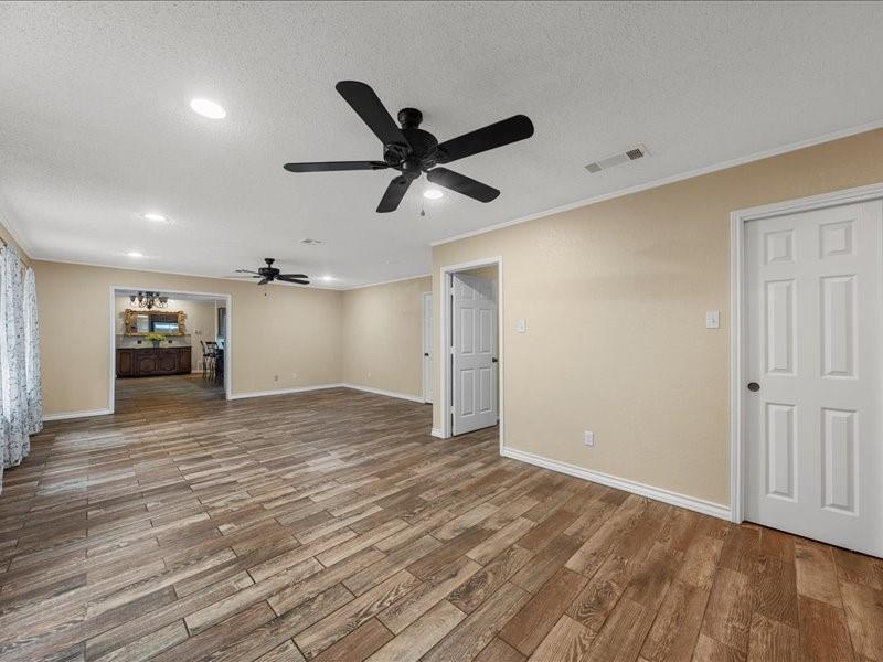 1072 Chapman Road Crawford, TX 76638 - Photo 13 of 39 a view of empty room with wooden floor
