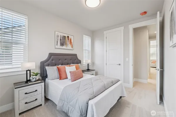 a bedroom with bed and cabinet