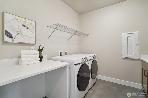 a utility room with dryer and washer