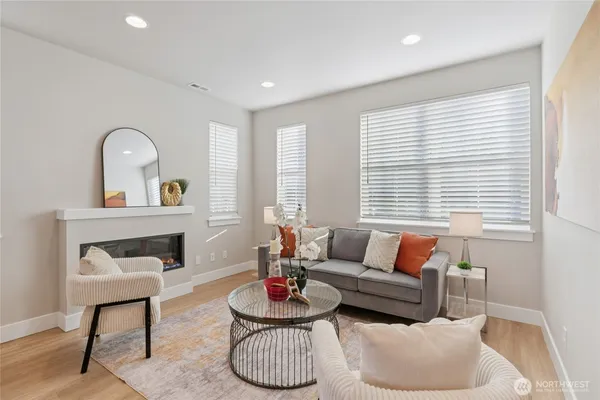 a living room with furniture and a large window