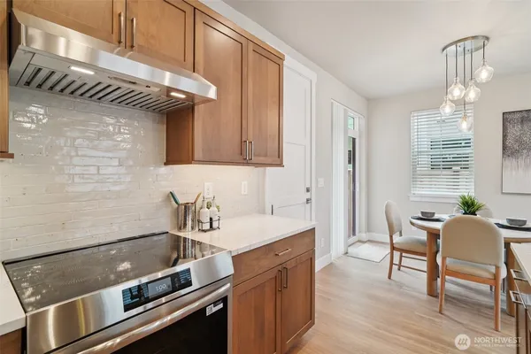 a kitchen with a sink cabinets and window