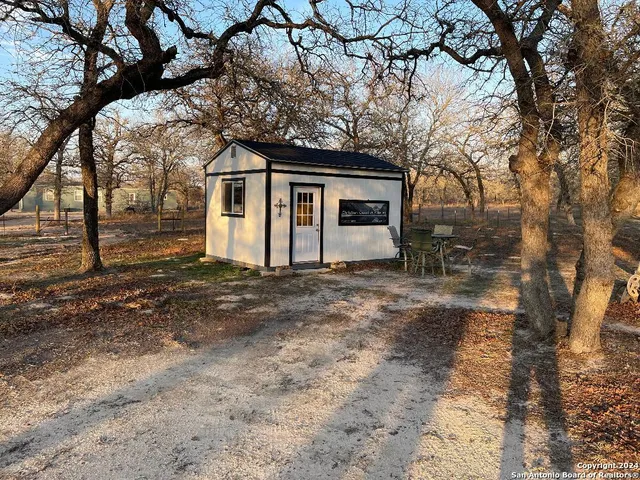 a house with a tree in front of it