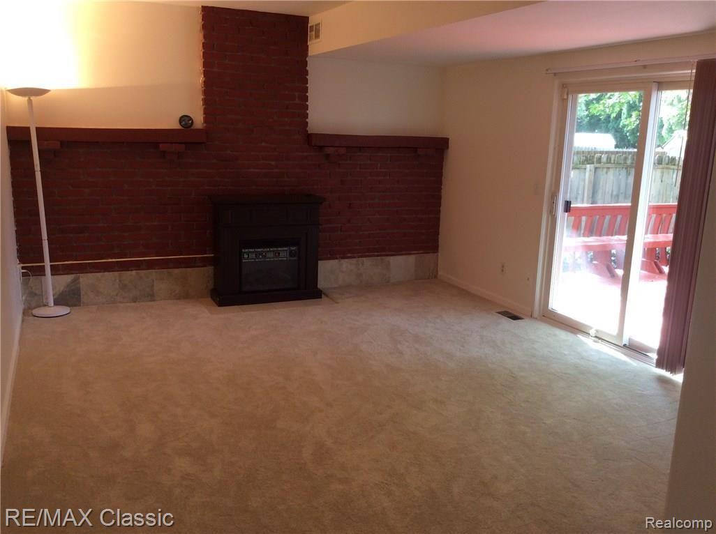 704 Burlington Road Canton, MI 48188 - Photo 21 of 40 Large FR w/brick wall and new fireplace