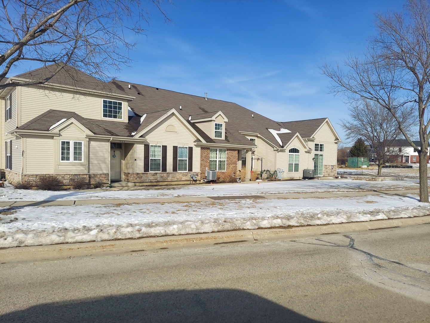 a view of white house with a outdoor space and garden view