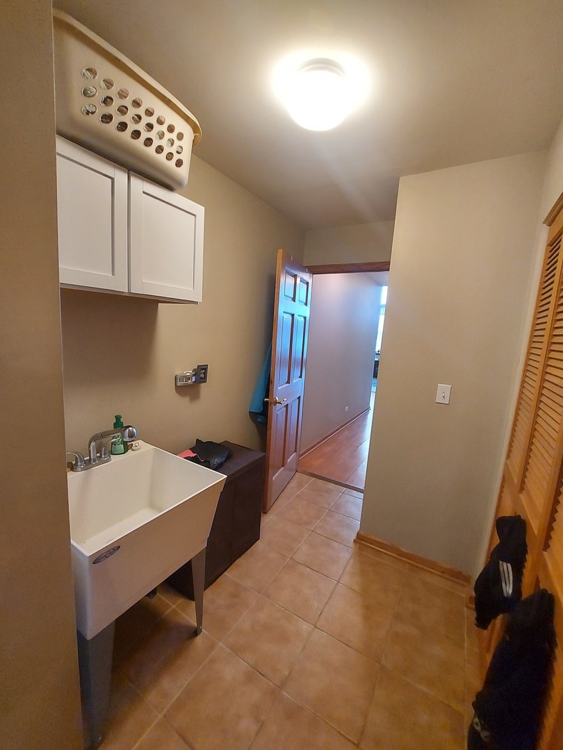 1022 Eineke Boulevard, Unit 1022 Algonquin, IL 60102 - Photo 18 of 18 a room with storage and utility