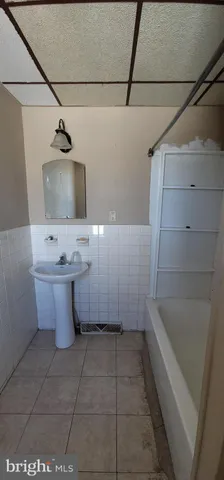 a bathroom with a bathtub sink and toilet