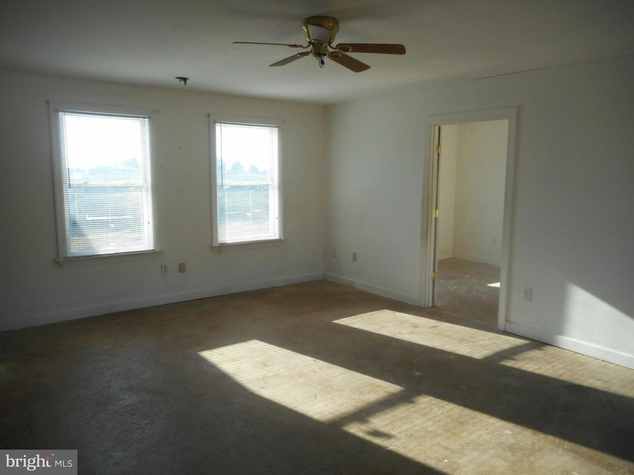 2313 Wingate Bishops Head Road Wingate, MD 21675 - Photo 13 of 18 a view of an empty room with a window