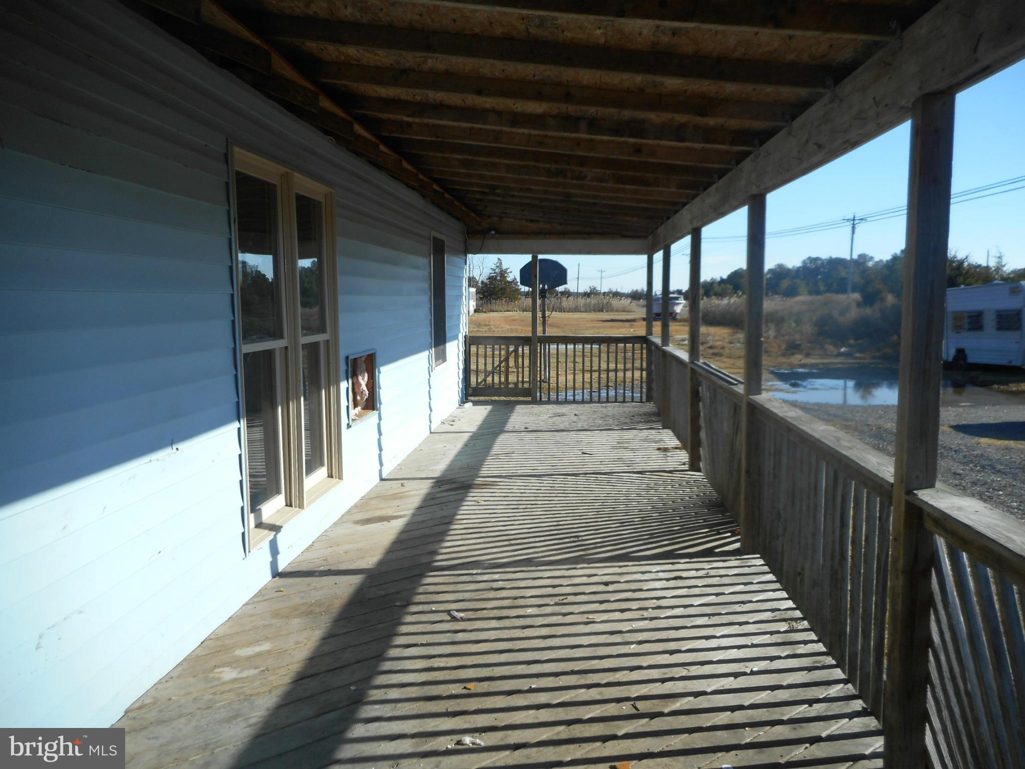 2313 Wingate Bishops Head Road Wingate, MD 21675 - Photo 14 of 18 a view of a porch with wooden floor