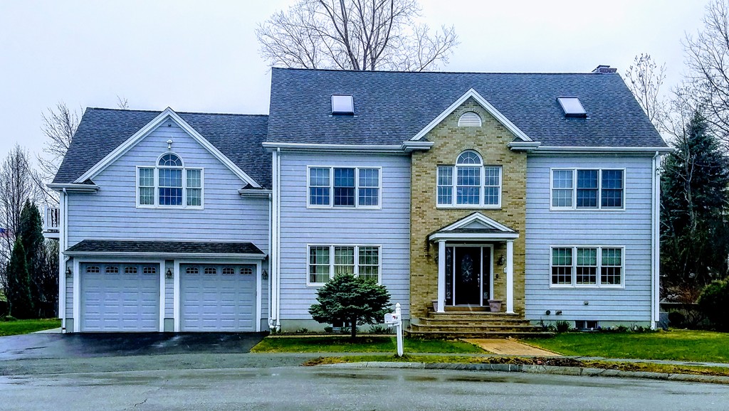 131 Range Heights Road Lynn, MA 01904 - Photo 1 of 30 a front view of a house with a yard