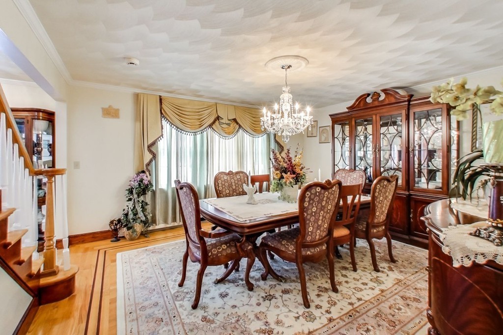 131 Range Heights Road Lynn, MA 01904 - Photo 11 of 30 a view of a dining room with furniture and chandelier