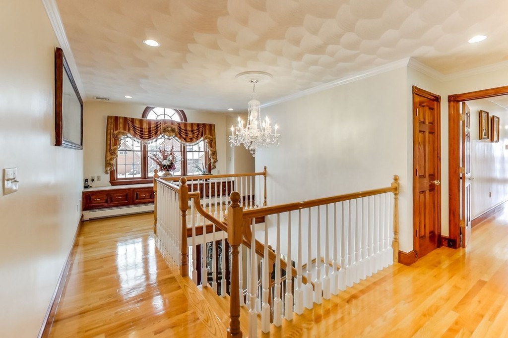 131 Range Heights Road Lynn, MA 01904 - Photo 13 of 30 a view of a hallway with furniture and floor to ceiling window