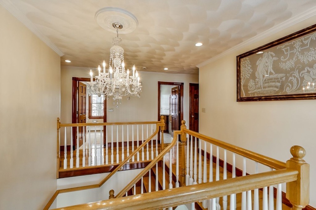 131 Range Heights Road Lynn, MA 01904 - Photo 14 of 30 a view of staircase with railing and a chandelier