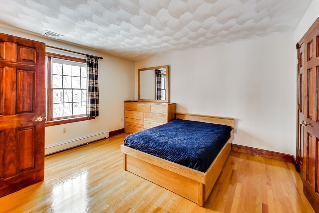 131 Range Heights Road Lynn, MA 01904 - Photo 15 of 30 a living room with a couch and dresser with wooden floor