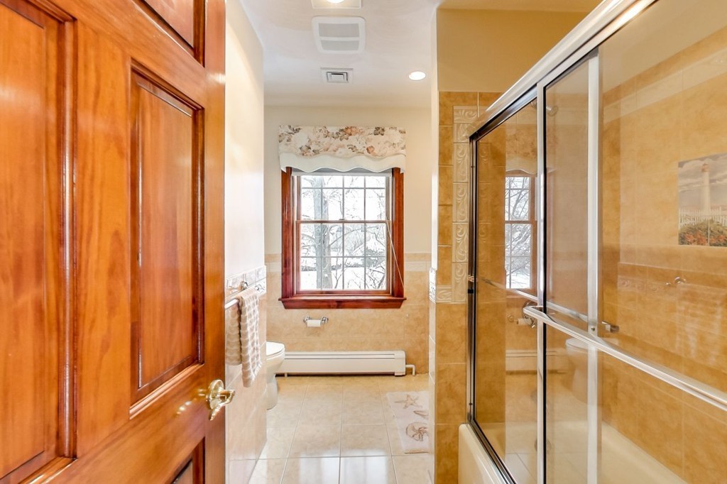 131 Range Heights Road Lynn, MA 01904 - Photo 19 of 30 a bathroom with a granite countertop sink and a shower