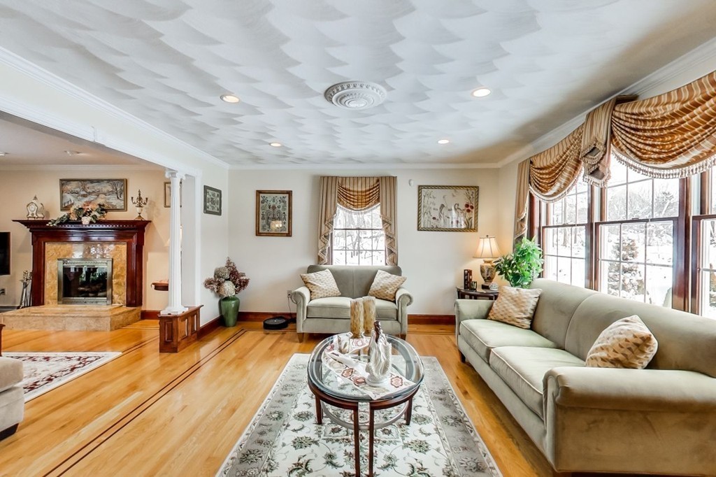 131 Range Heights Road Lynn, MA 01904 - Photo 2 of 30 a living room with furniture a window and a chandelier