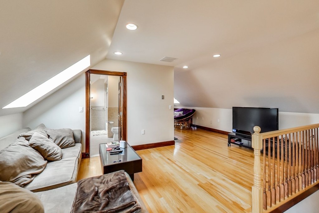 131 Range Heights Road Lynn, MA 01904 - Photo 26 of 30 a bedroom with furniture and a wooden floor