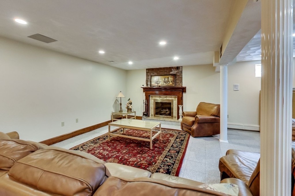131 Range Heights Road Lynn, MA 01904 - Photo 28 of 30 a living room with furniture and a fireplace